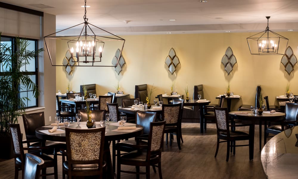 Outdoor patio gathering at Keystone Place at Four Mile Cove in Cape Coral, Florida