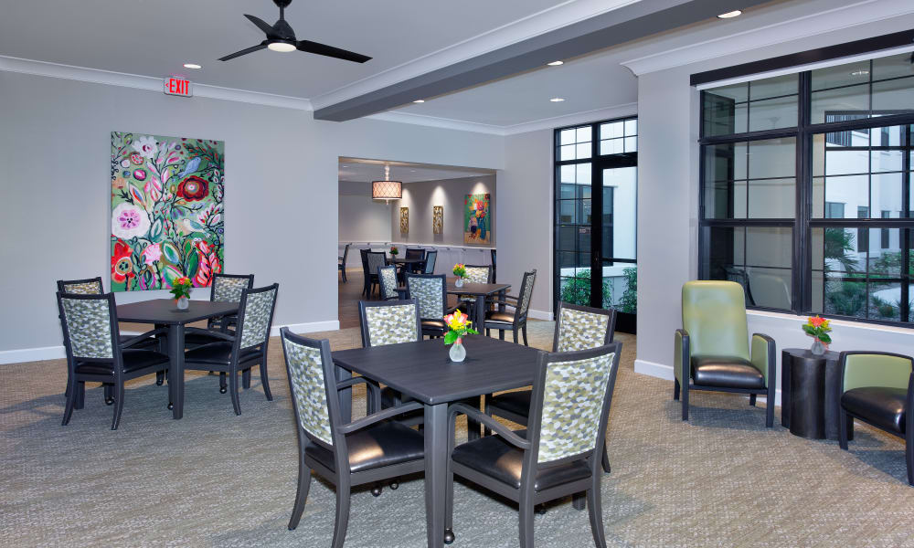 Dining room tables set for a feast at Keystone Place at Naples Preserve in Naples, Florida