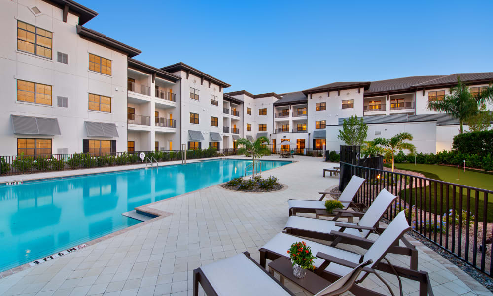 Outdoor pool area at Keystone Place at Naples Preserve in Naples, Florida