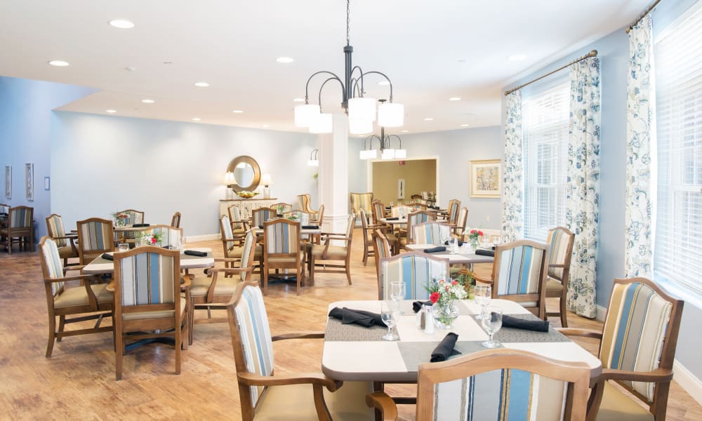 Set dining room tables at Keystone Place at Newbury Brook in Torrington, Connecticut