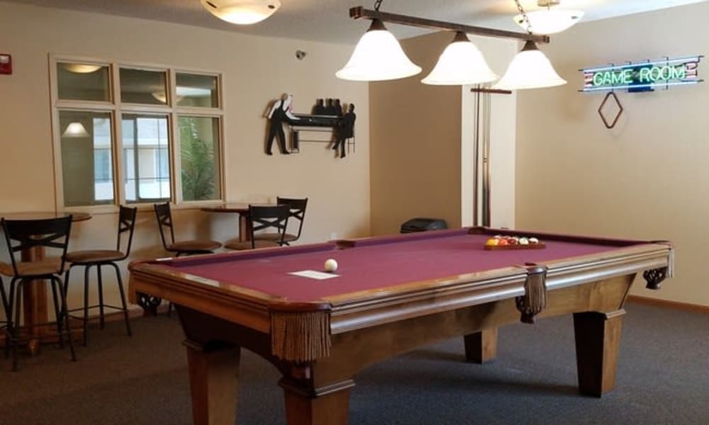 A billiards table with seating at Parkway Gardens Senior Apartment Community in Saint Paul, Minnesota