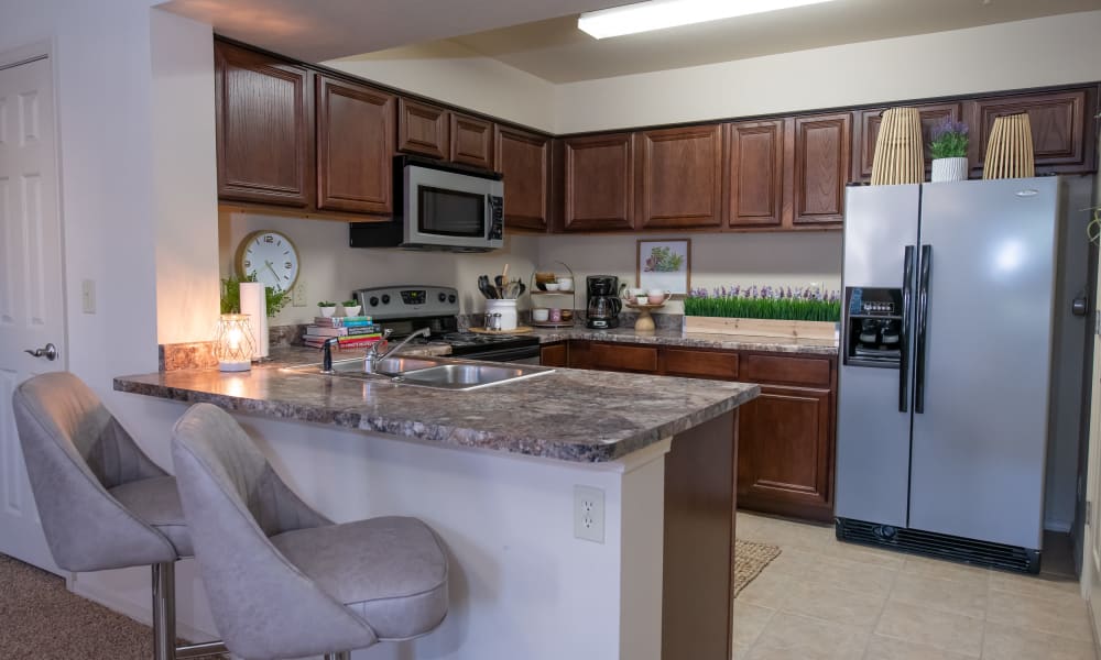 An apartment kitchen at Coffee Creek Apartments in Owasso, Oklahoma