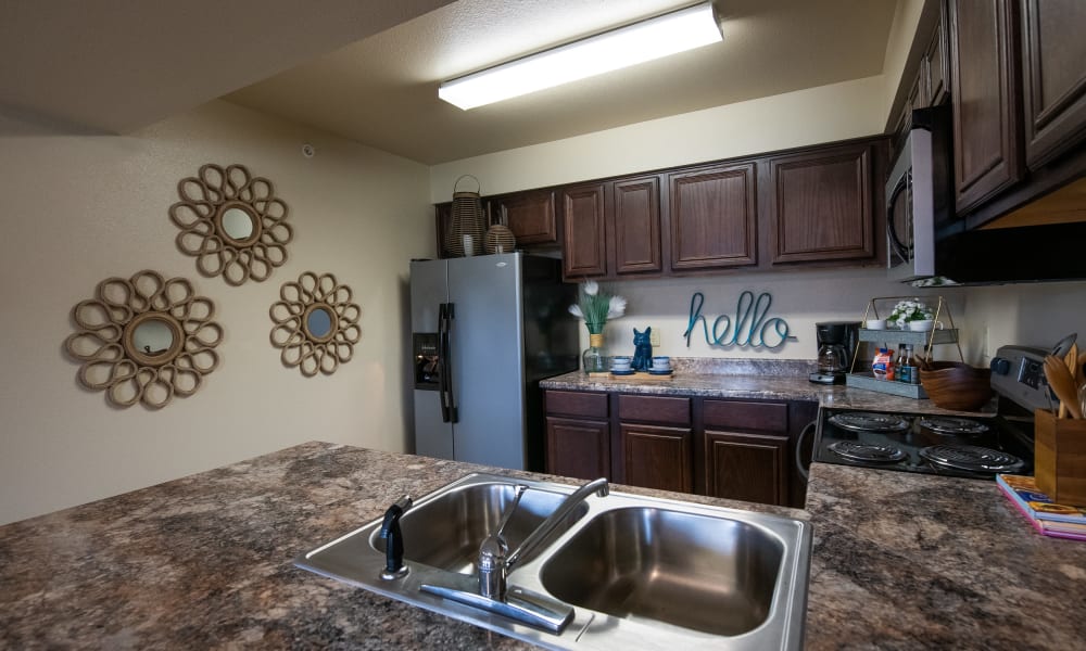 An apartment kitchen at Park at Mission Hills in Broken Arrow, Oklahoma