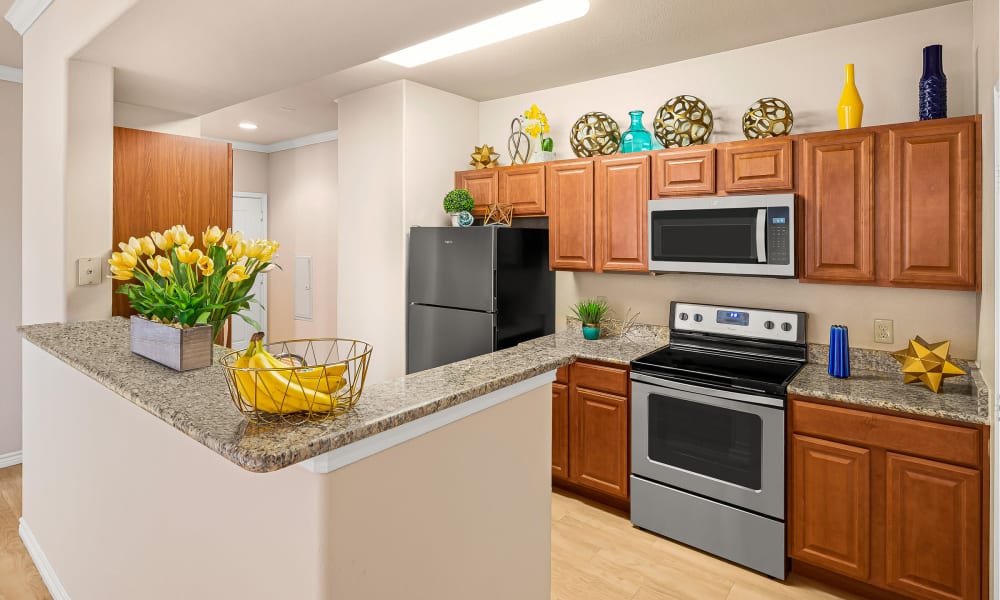 Plank flooring in a spacious kitchen at Villas in Westover Hills in San Antonio, Texas