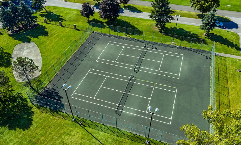 Aerial view of the tennis courts at Idylwood Resort Apartments in Cheektowaga, New York