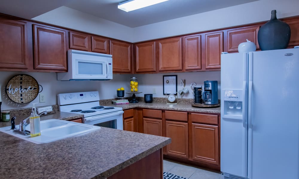 An apartment kitchen at Nickel Creek Apartments in Tulsa, Oklahoma