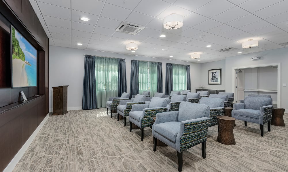 A movie viewing room with comfortable chairs at Atrium at Liberty Park in Cape Coral, Florida