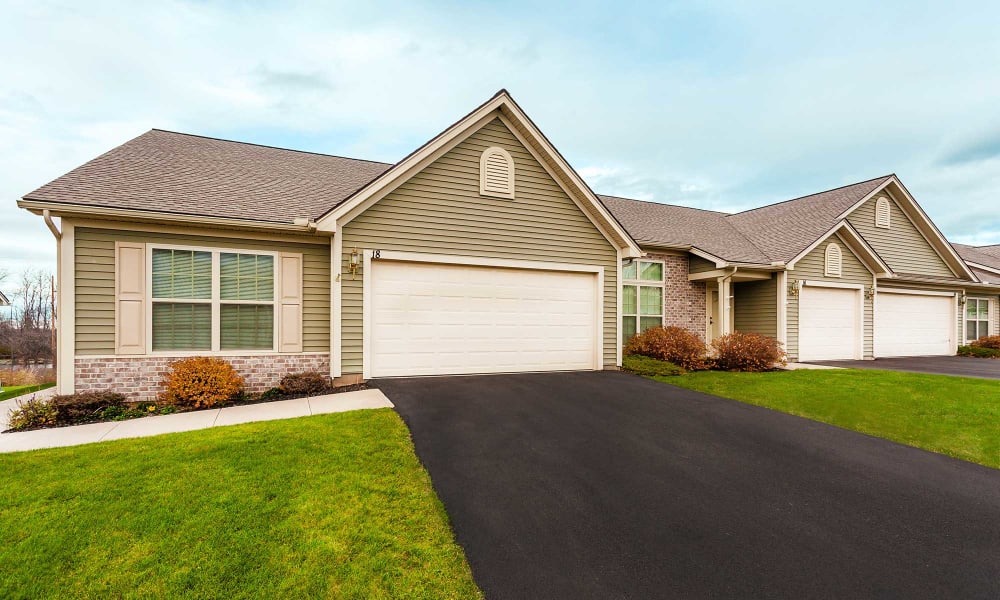 Townhome with a private garage and wide driveway at Hickory Hollow in Spencerport, New York
