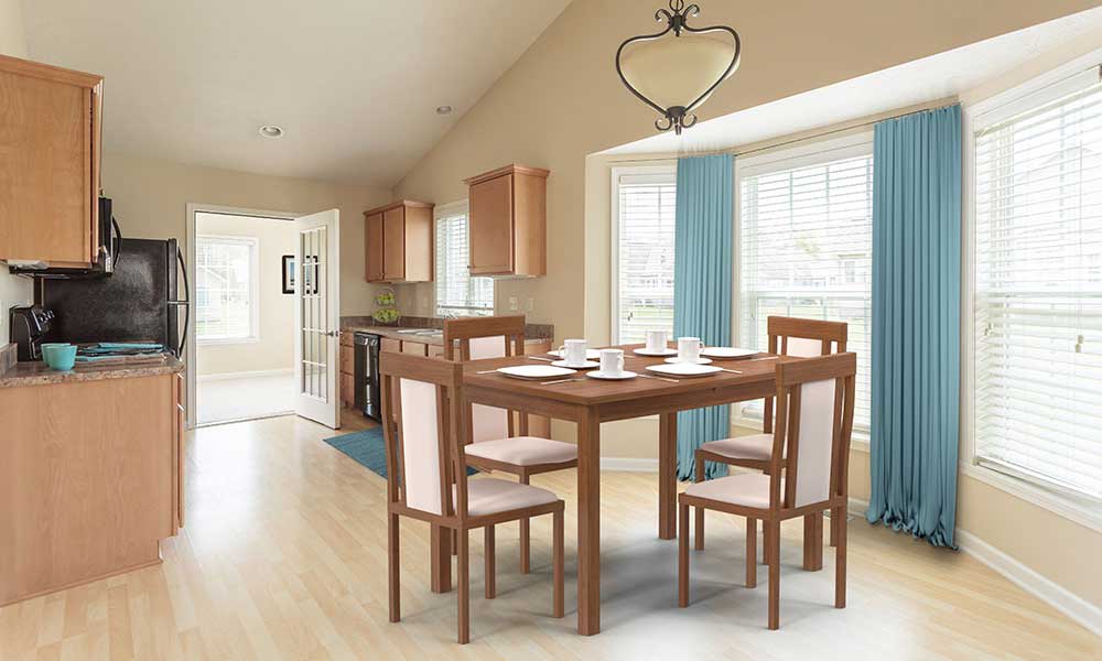 Spacious dining area with great natural light and open kitchen at Hickory Hollow in Spencerport, New York