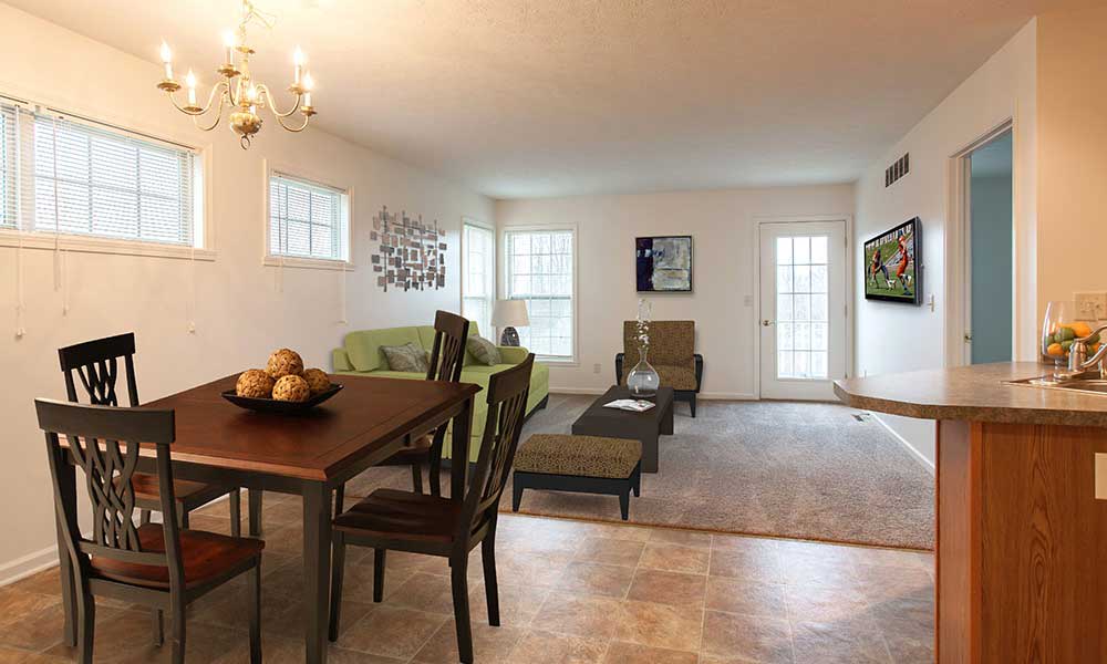 Dining area and living room of a model home at Hickory Hollow in Spencerport, New York