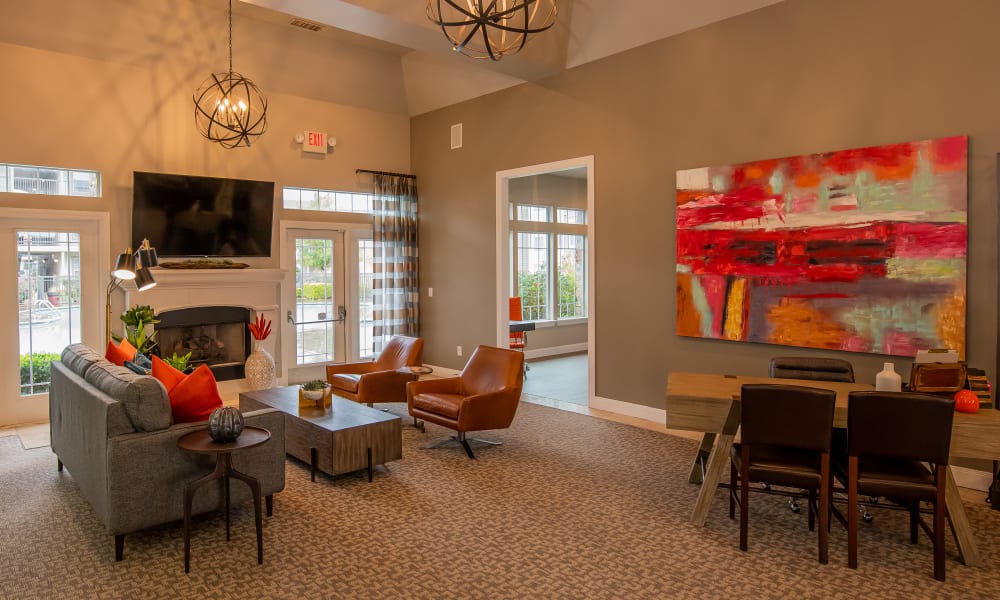 The clubhouse with plenty of seating and large tv at Colonies at Hillside in Amarillo, Texas