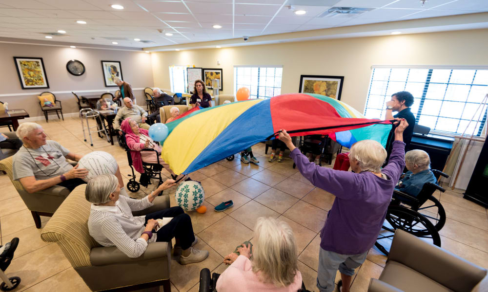 Residents playing a wellness game at Inspired Living Lewisville in Lewisville, Texas