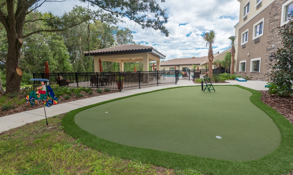 A small Putting green at Inspired Living Lewisville in Lewisville, Texas
