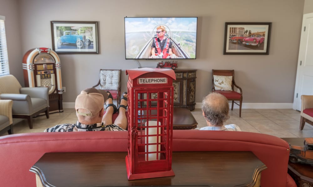 Two residents watching TV at Inspired Living Sarasota in Sarasota, Florida