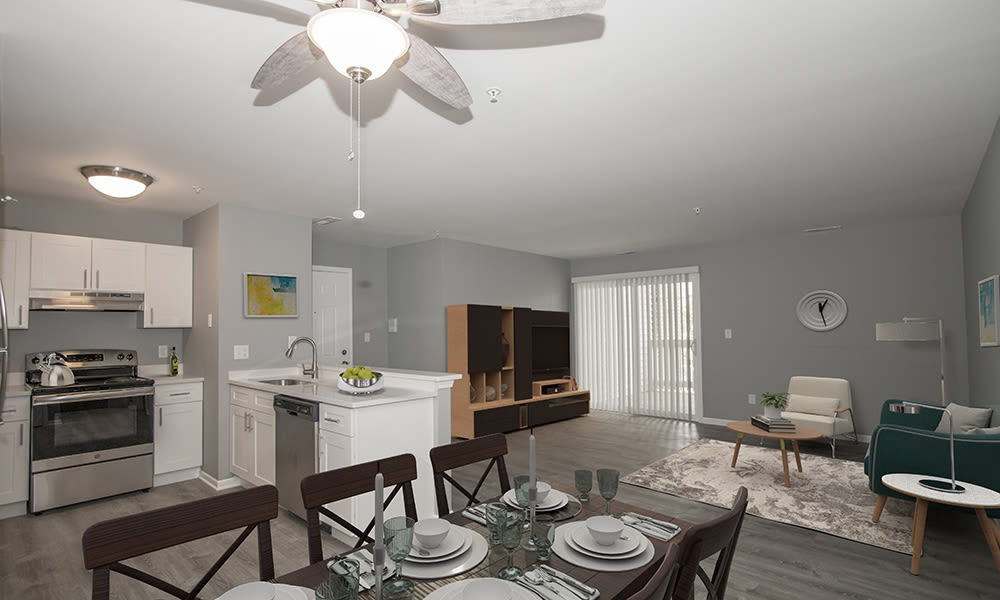 Dining area and living space at The Lakes at 8201 in Merrillville, Indiana