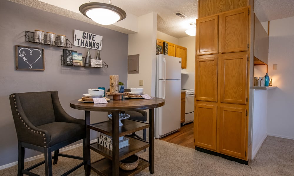 An apartment kitchen and dining room at Tammaron Village Apartments in Oklahoma City, OK