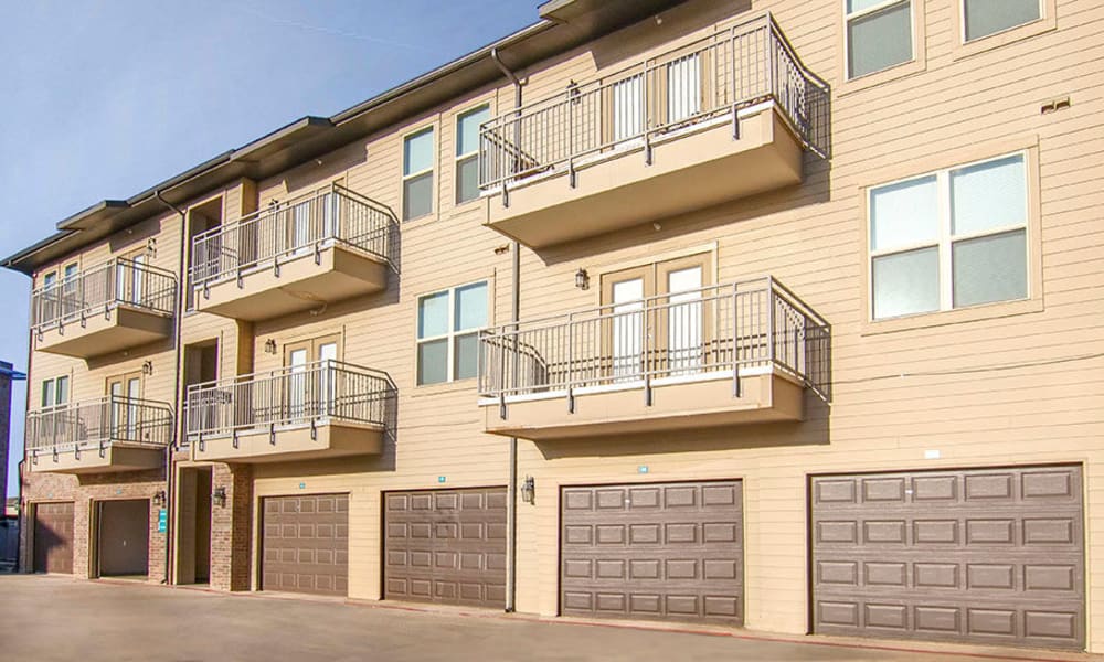 Resident balconies with private parking garages below at Anatole on Briarwood in Midland, Texas