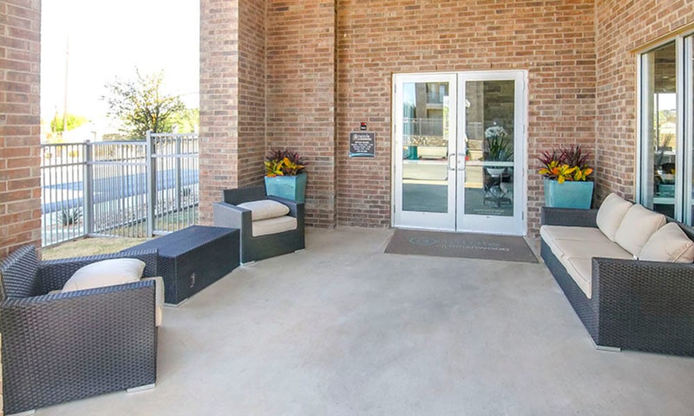 Lounge seating outside the leasing office entrance at Anatole on Briarwood in Midland, Texas
