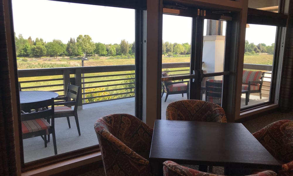 Balcony seating area in the bistro at Quail Park at Shannon Ranch in Visalia, California