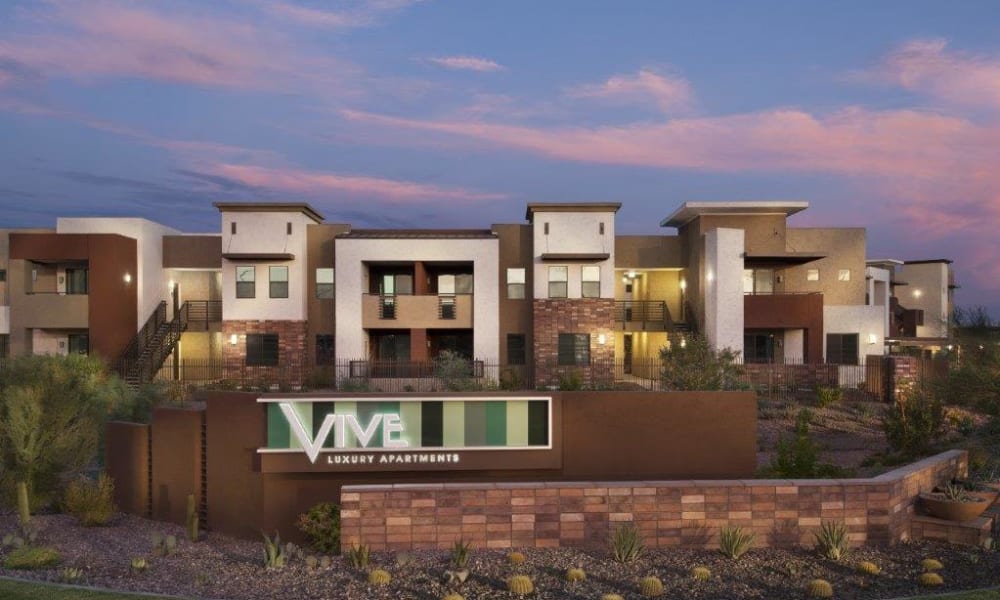Dusk view of our sign and resident buildings at Vive in Chandler, Arizona