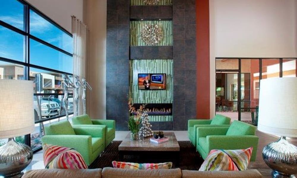 Flatscreen TVs and a fireplace in the clubhouse lounge at Vive in Chandler, Arizona