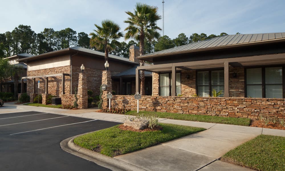 Exterior view of the leasing center on a beautiful morning at Wimberly at Deerwood in Jacksonville, Florida