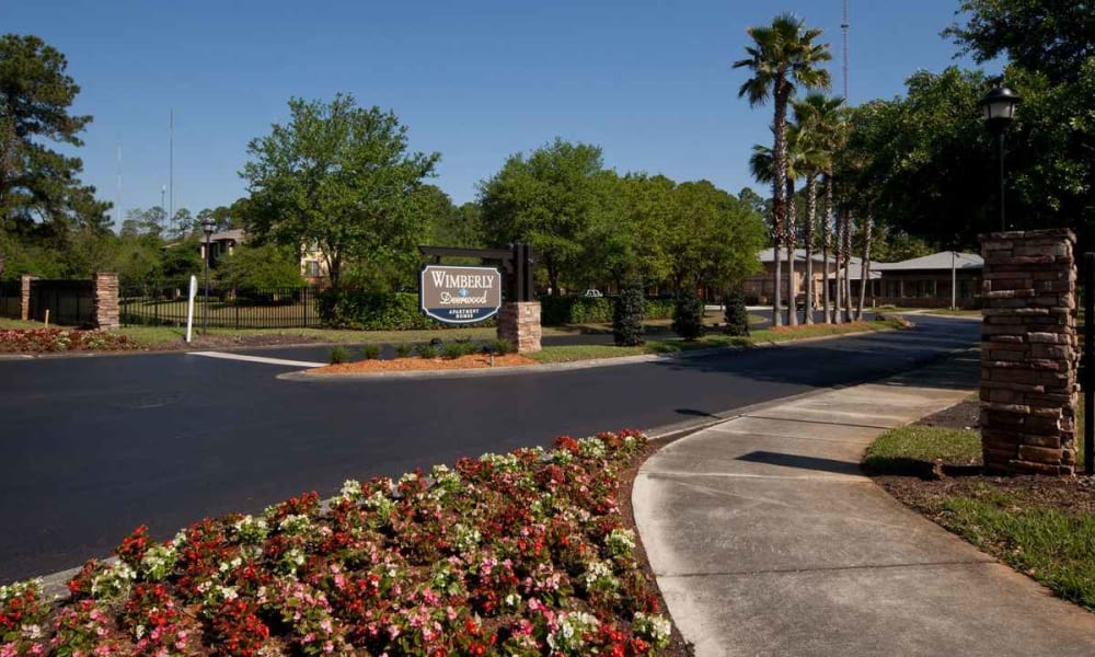 Professionally maintained landscaping at the entrance to Wimberly at Deerwood in Jacksonville, Florida