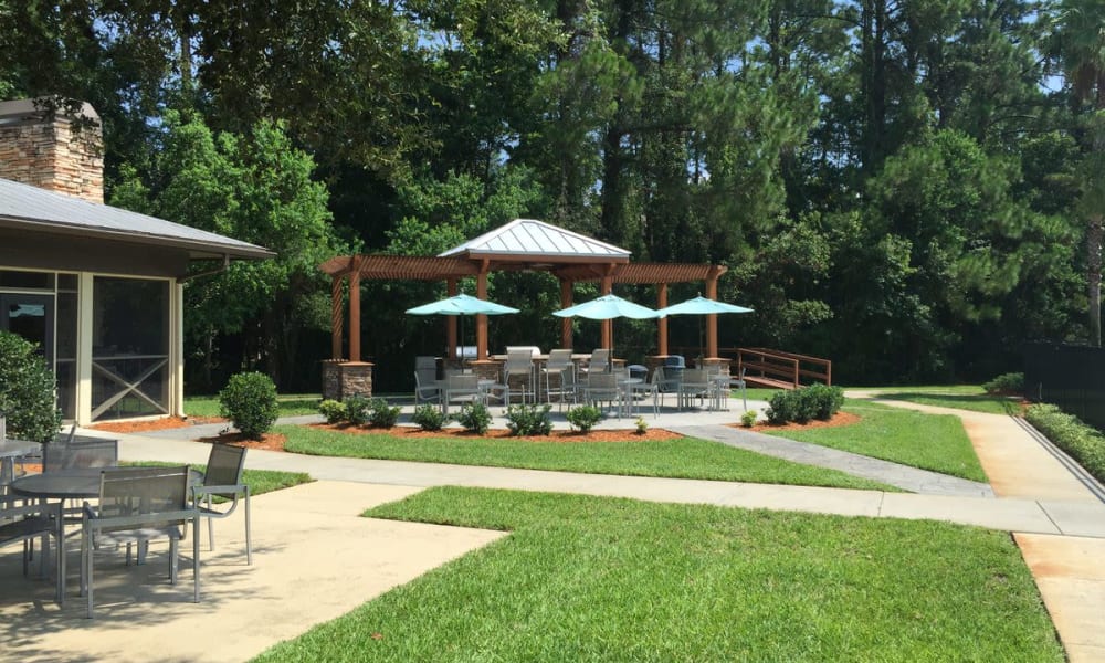 Beautifully maintained lawns between walking paths at Wimberly at Deerwood in Jacksonville, Florida
