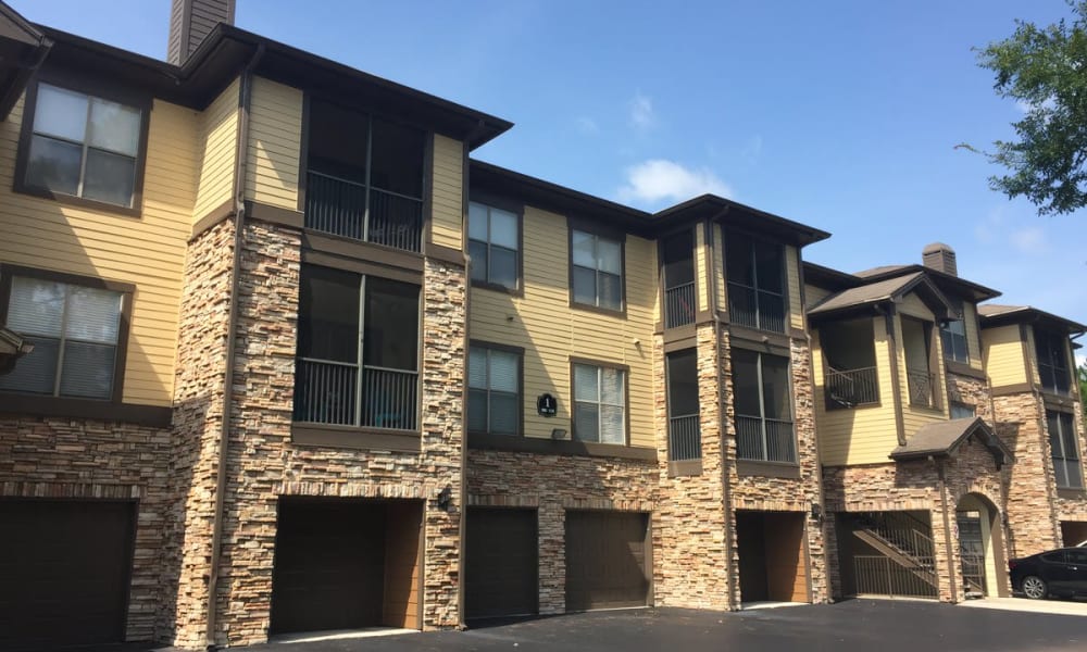 Exterior view of resident buildings with private garages at Wimberly at Deerwood in Jacksonville, Florida