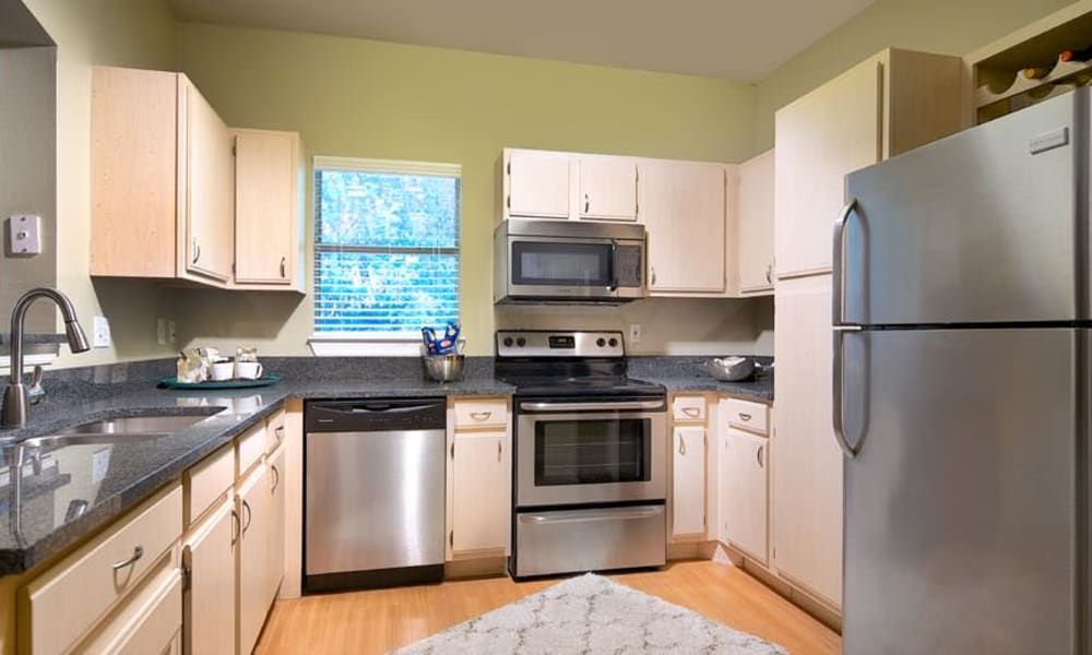 Well-lit gourmet kitchen in a model apartment at Wimberly at Deerwood in Jacksonville, Florida