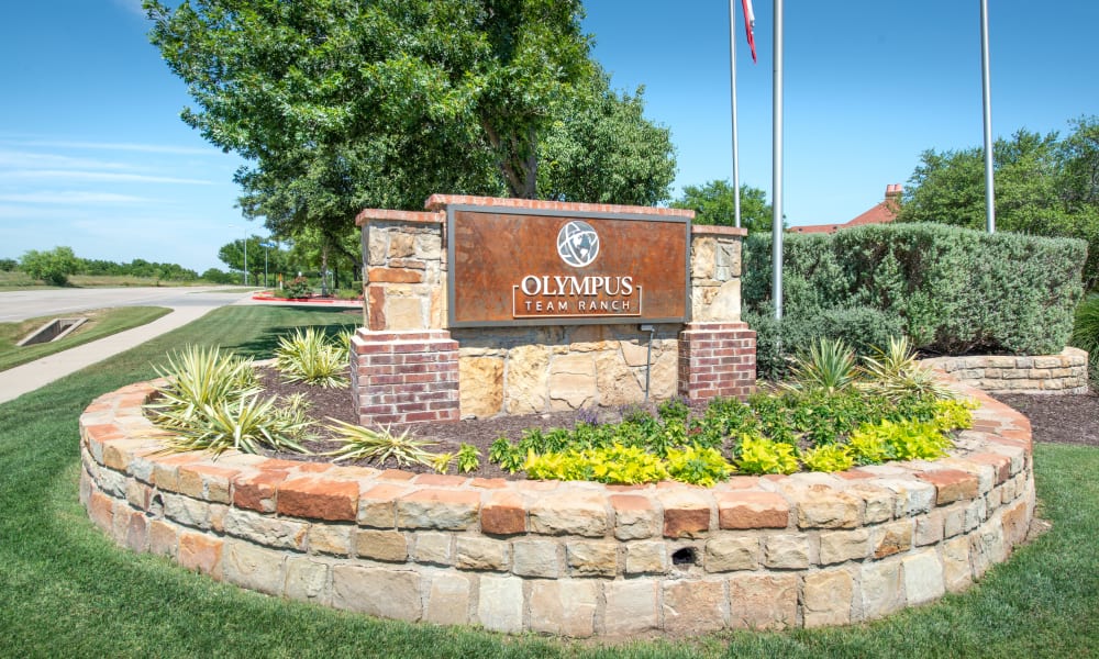 Community sign at entrance to Olympus Team Ranch in Benbrook, Texas