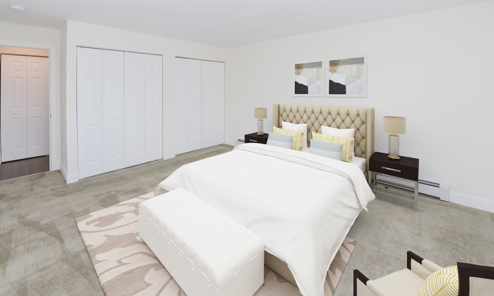 Model bedroom with plush carpeting and ample closet space at Kingswood Apartments & Townhomes in King of Prussia, Pennsylvania
