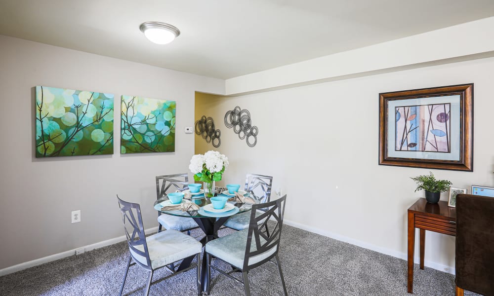 Dining table at the intersection between the kitchen and living room at Regency Pointe in Forestville, Maryland
