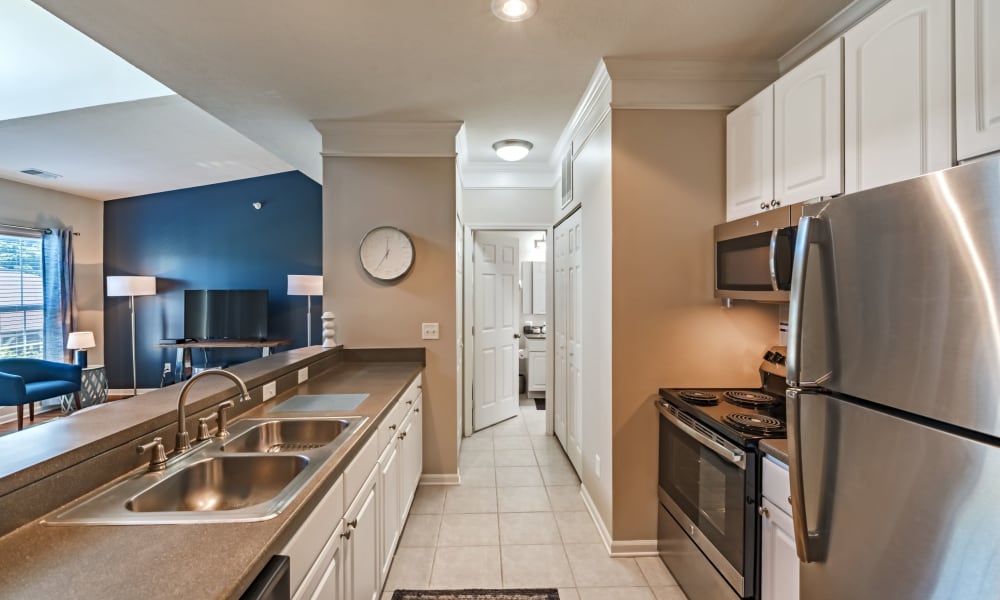 Modern kitchen with stainless steel appliances at The Docks Apartments & Townhomes in Pittsburgh, Pennsylvania