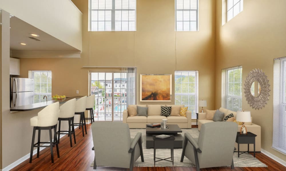 Naturally well-lit living space at The Waterfront Apartments & Townhomes in Munhall, Pennsylvania