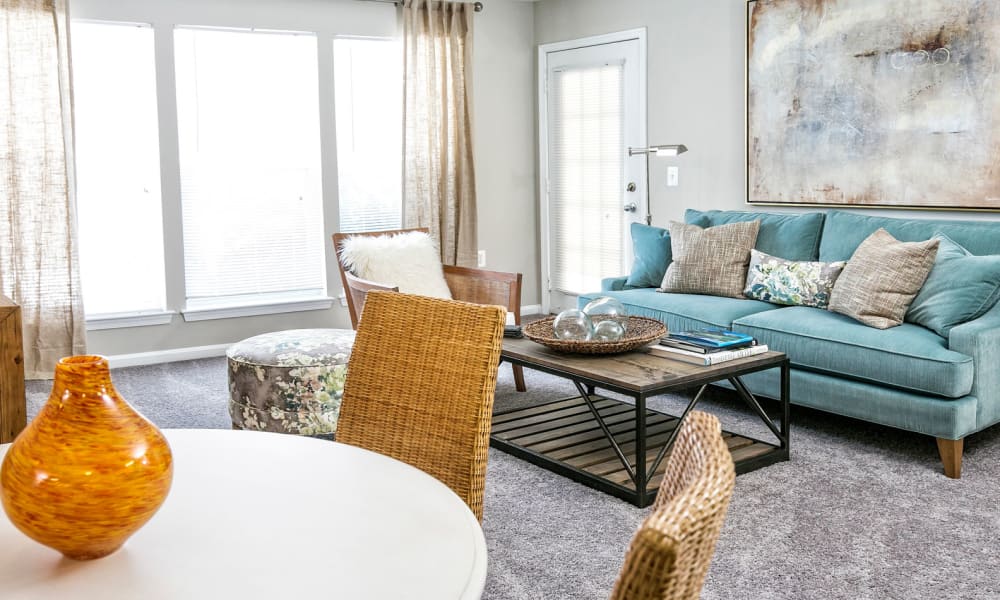 Floor-to-ceiling windows in a model home's living area at Arbor Ridge Apartments in Owings Mills, Maryland