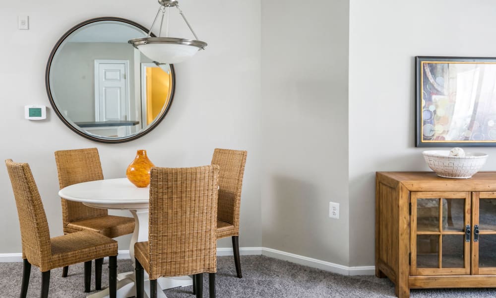 Well-furnished dining nook in a model apartment at Arbor Ridge Apartments in Owings Mills, Maryland
