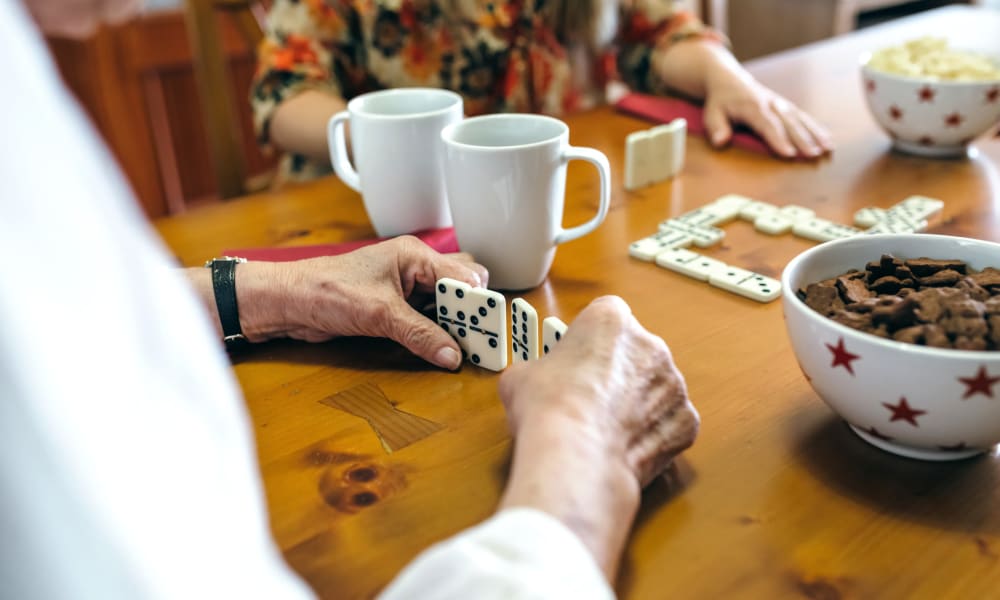 Residents playing dominoes at Randall Residence of Troy in Troy, Ohio