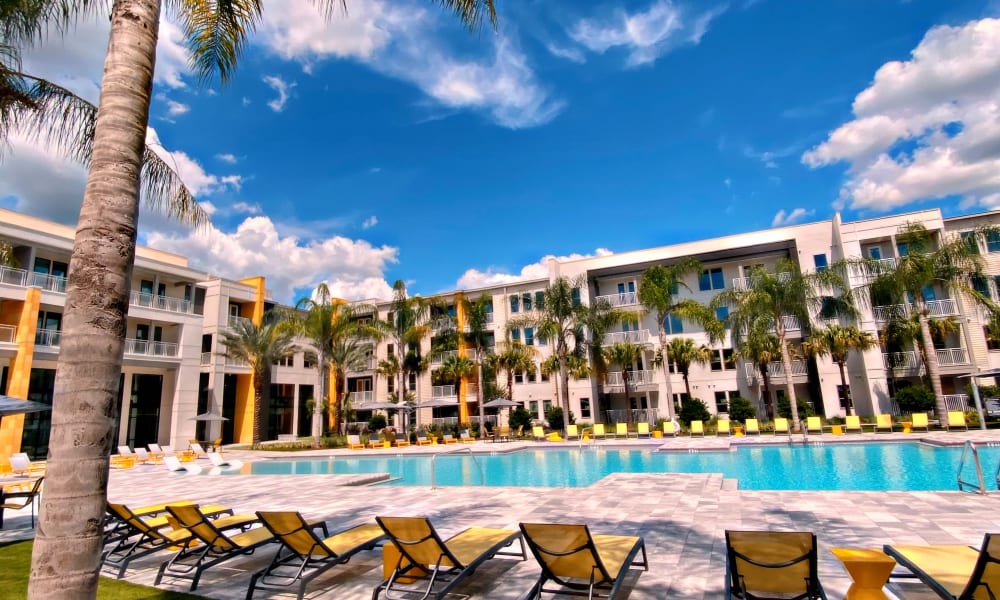 Resort style pool and seating at Fusion apartments in Jacksonville, Florida