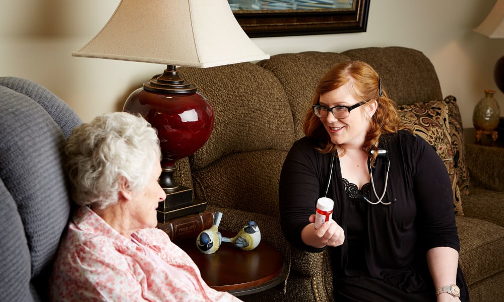 Nurse talking to a resident about medication at Deer Crest Senior Living in Red Wing, Minnesota