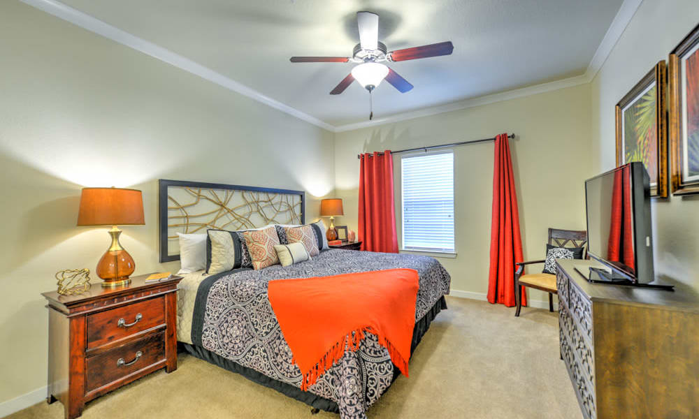 Large bedroom with fan at Hacienda Club in Jacksonville, FL