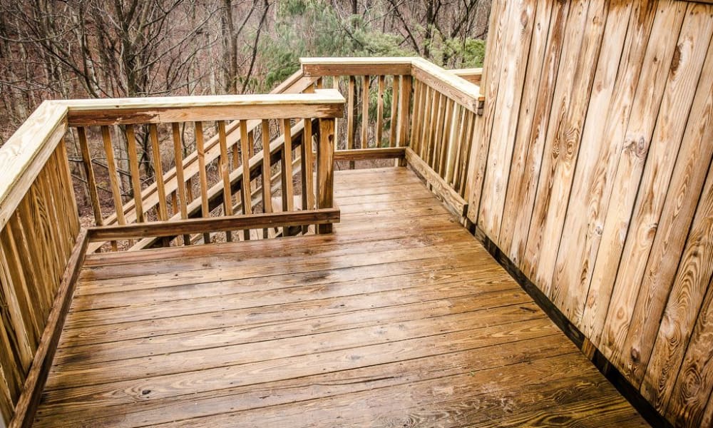 A wooden deck at Greenhills Apartments & Townhomes in Damascus, Maryland