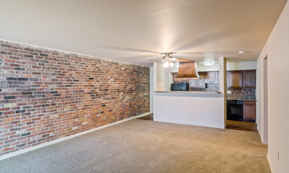 Carpeted living room at Thirty43 by the Greene in Kettering, Ohio