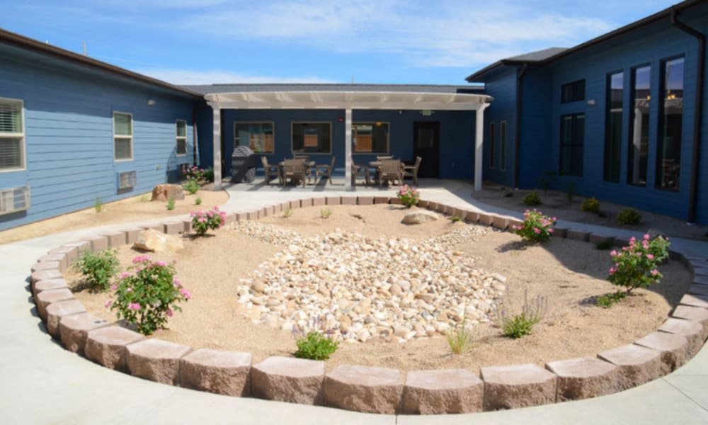 Circular walking path with a rock garden at its center at Aspen Valley Senior Living in Boise, Idaho