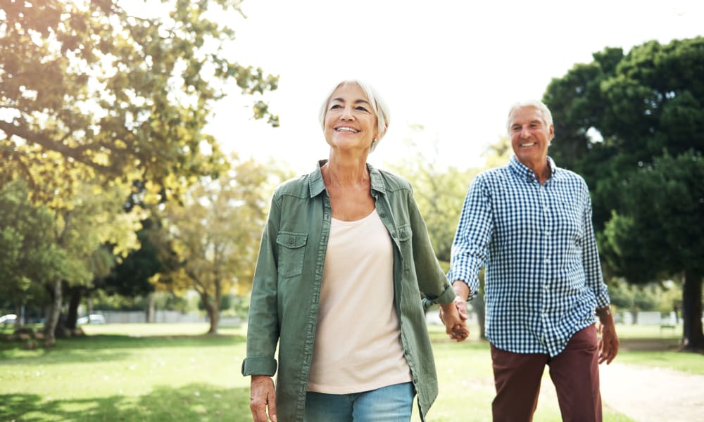 Couple walking through a park near Mount Carmel Apartments in Mount Carmel, Pennsylvania