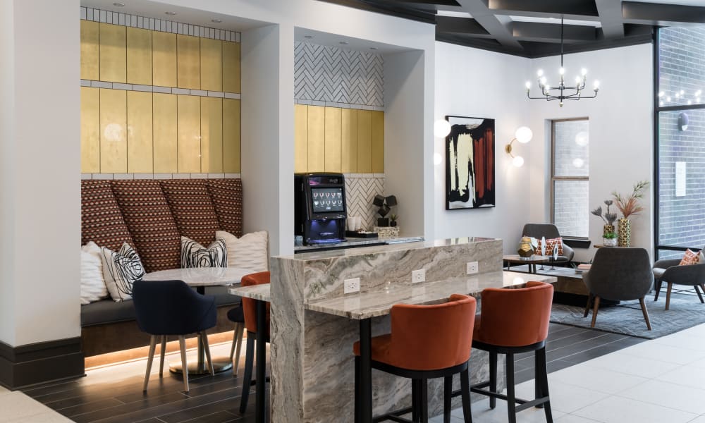 Spend time with friends and family in the common area at The ReVe in Garland, Texas
