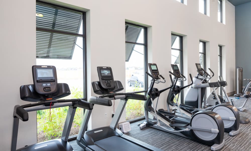 Fitness center with cardio equipment at Bellrock Market Station in Katy, Texas