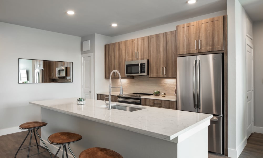 Kitchen with granite counters at Bellrock Market Station in Katy, Texas