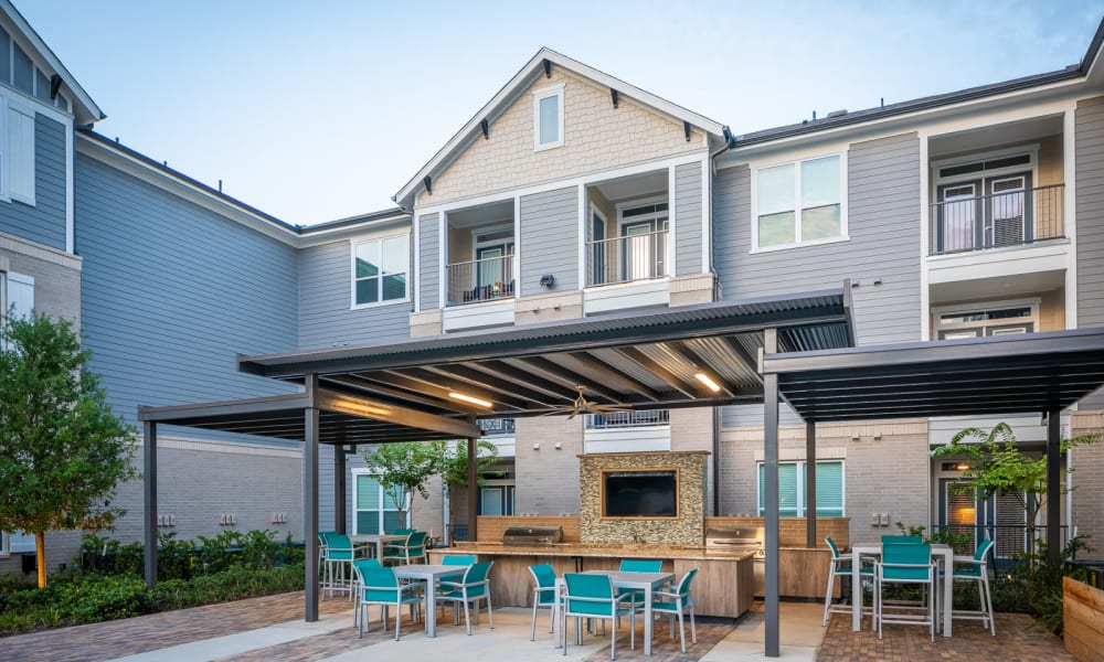 Outdoor poolside social space at Bellrock Market Station in Katy, Texas