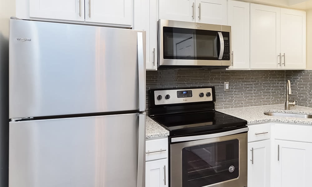 Fully-equipped kitchen at Idylwood Resort Apartments in Cheektowaga, New York